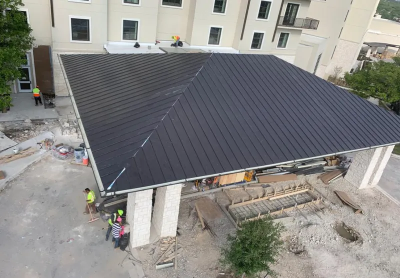Metal roofing installation team working on a commercial building in Horn Lake