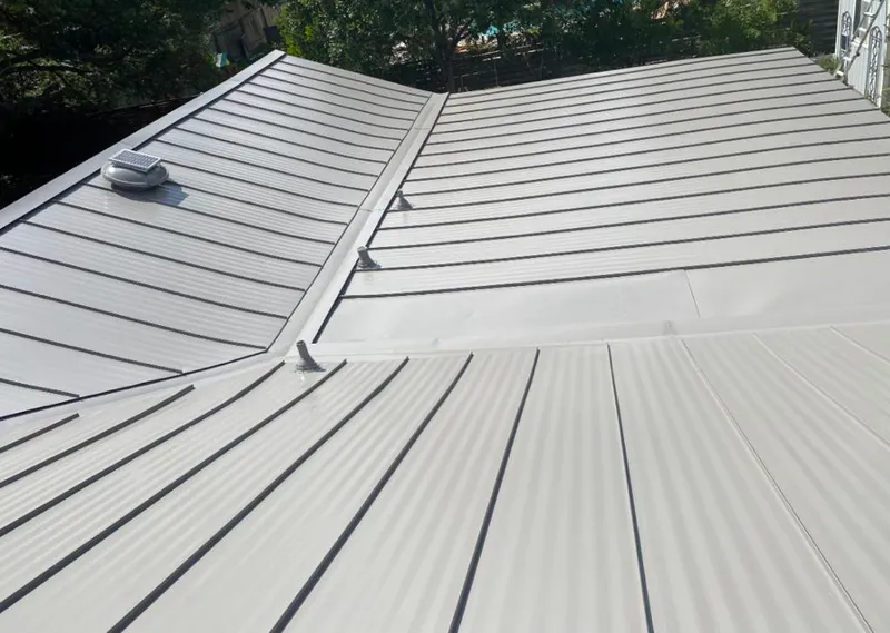 Solar attic fan installed on a metal roof for Roof Ventilation in Horn Lake